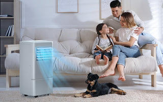 Family with a dog is realxing on living room's sofa enjoying the cooling air from airchoice portable ac.